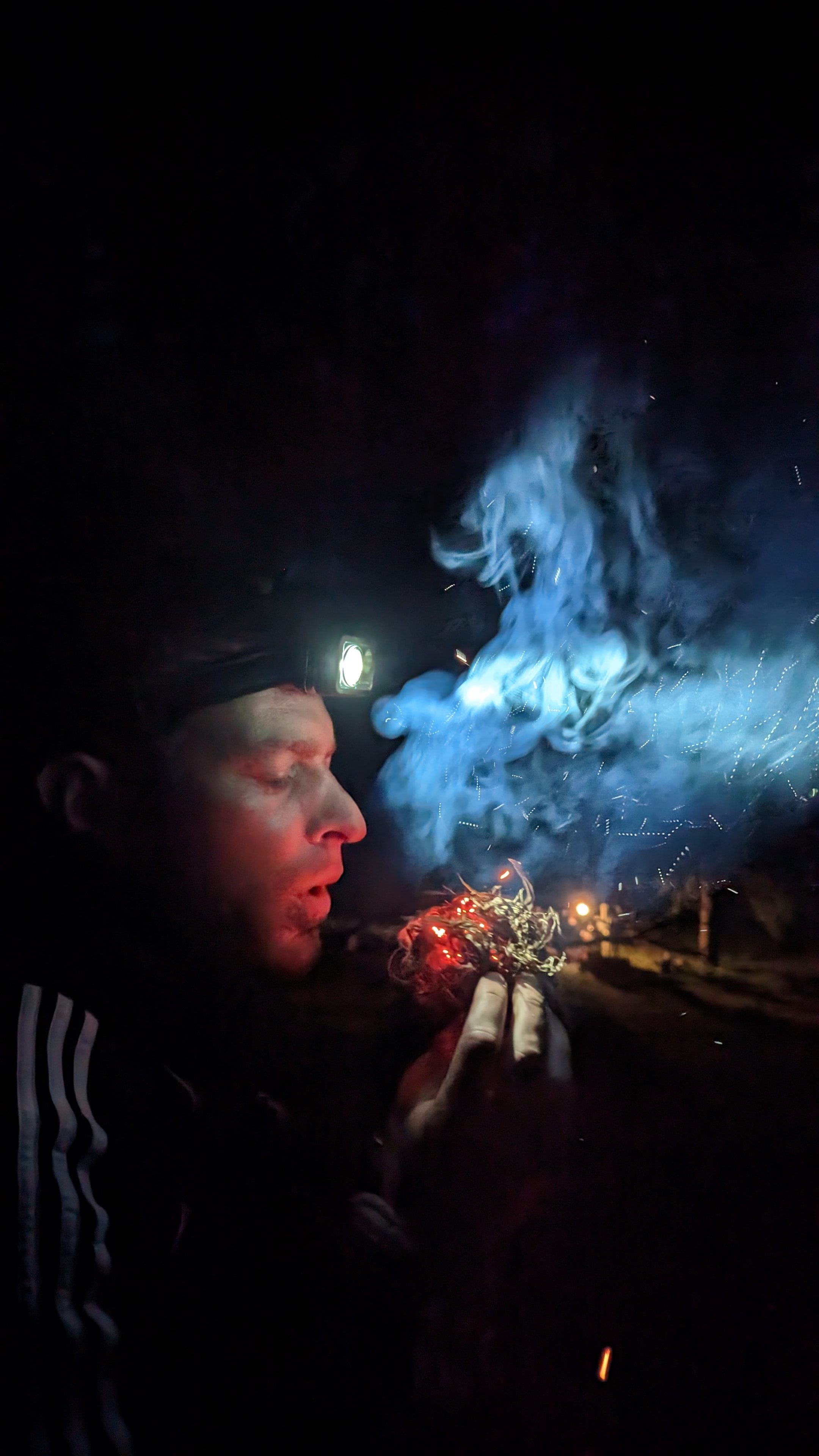Kyle Thomson demonstrating fire-starting techniques in the field